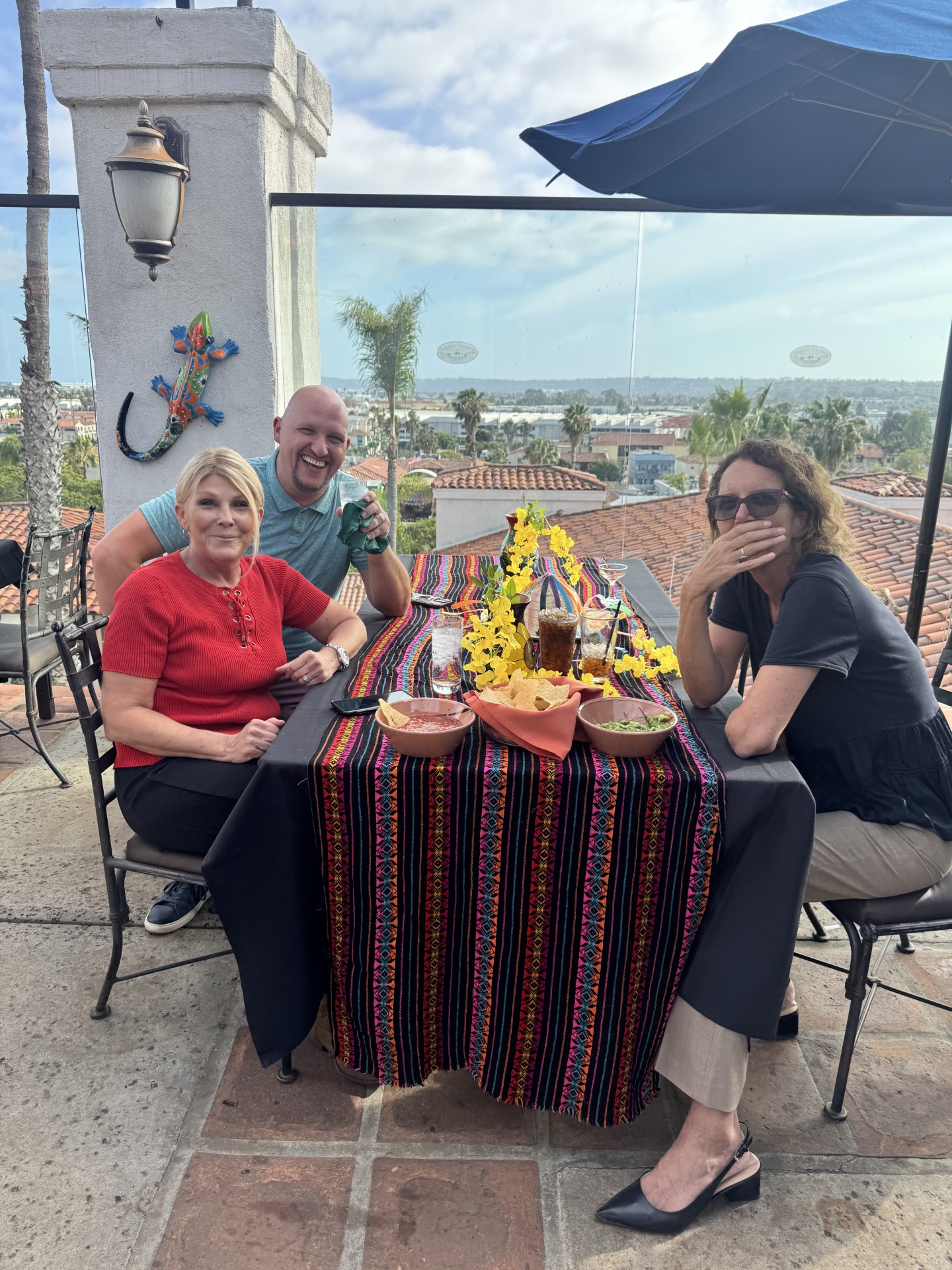 Guests laughing over drinks
